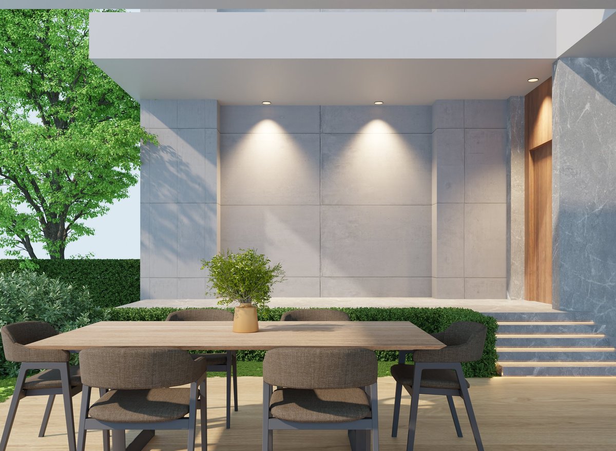 Shaded backyard dining area with table in soft morning light